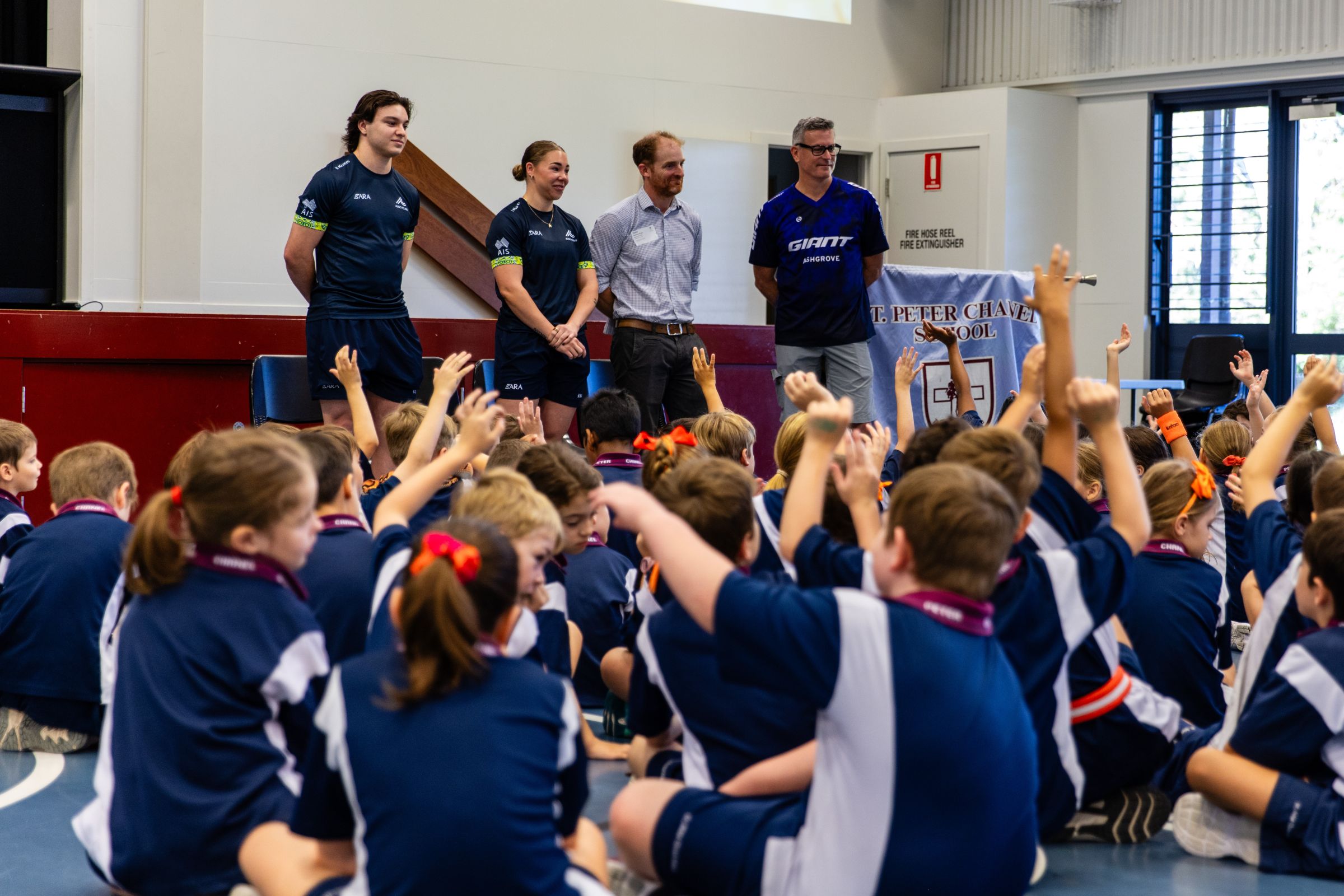 ARA Australian Cycling Team athletes Molly McGill and Ryan Elliott talk to students of St Peter Chanel Primary School as part of Ride2School Day and Brisbane Cycling Festival.